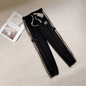 Adidas Women's Black Joggers with White Stripes